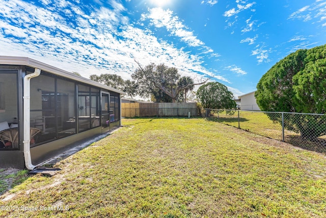 view of yard featuring a sunroom