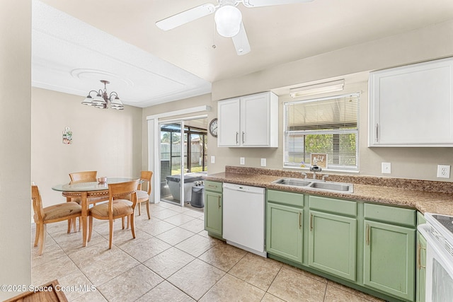 kitchen with sink, white cabinetry, pendant lighting, white appliances, and a healthy amount of sunlight