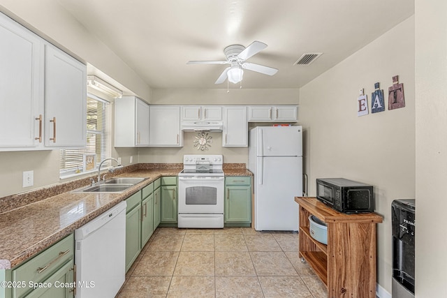 kitchen with sink, white appliances, white cabinets, green cabinetry, and light tile patterned flooring