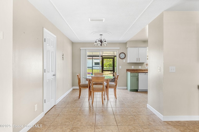 tiled dining area with a notable chandelier