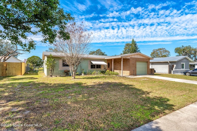 ranch-style house with a garage and a front lawn