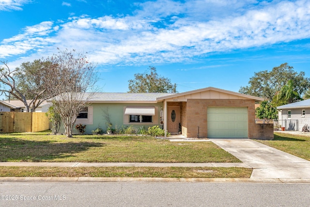 ranch-style home with a garage and a front lawn