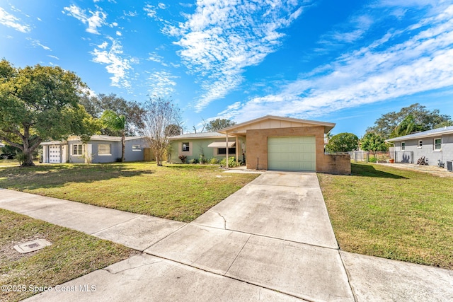 ranch-style home featuring a garage and a front yard