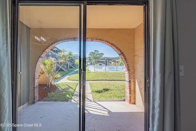 doorway featuring concrete floors