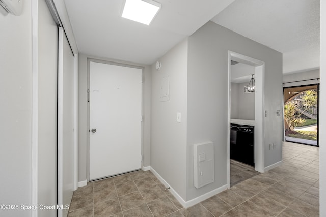 hallway featuring light tile patterned flooring