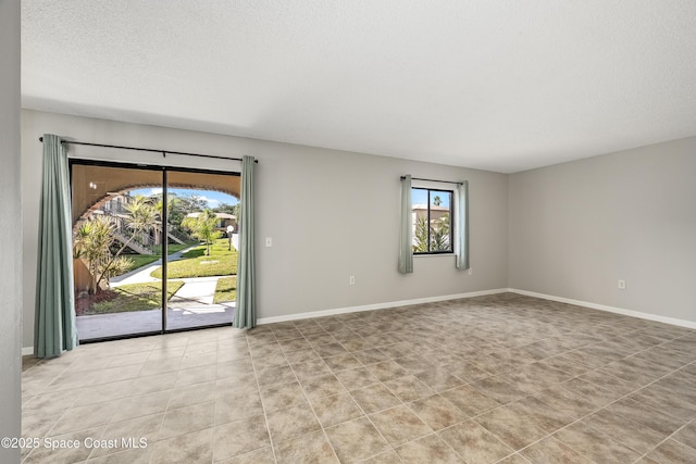 empty room with a textured ceiling