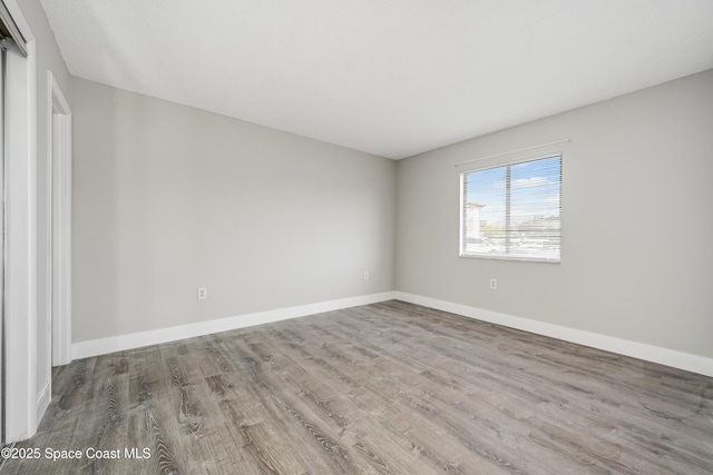 unfurnished room featuring wood-type flooring