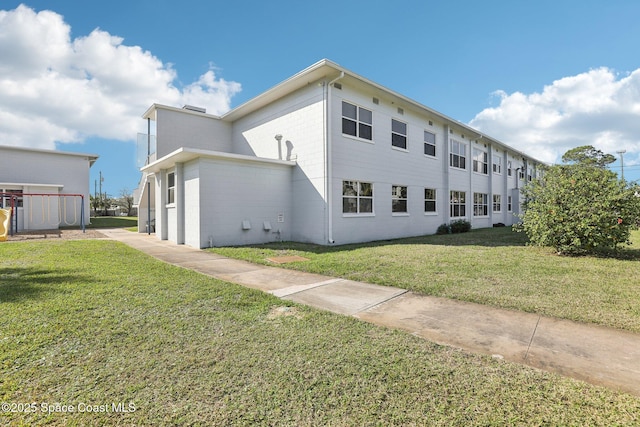 view of property exterior featuring a lawn