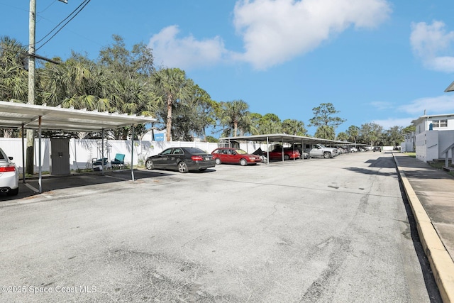 view of vehicle parking featuring a carport