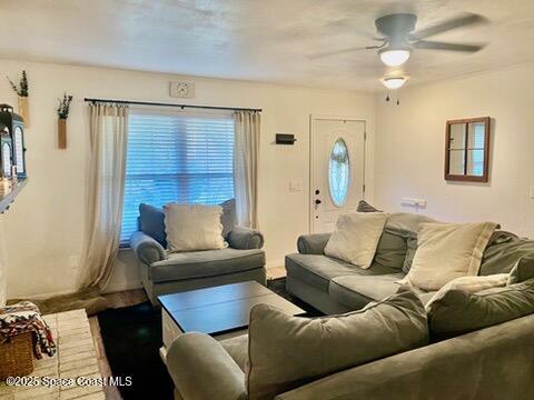 living room with ceiling fan