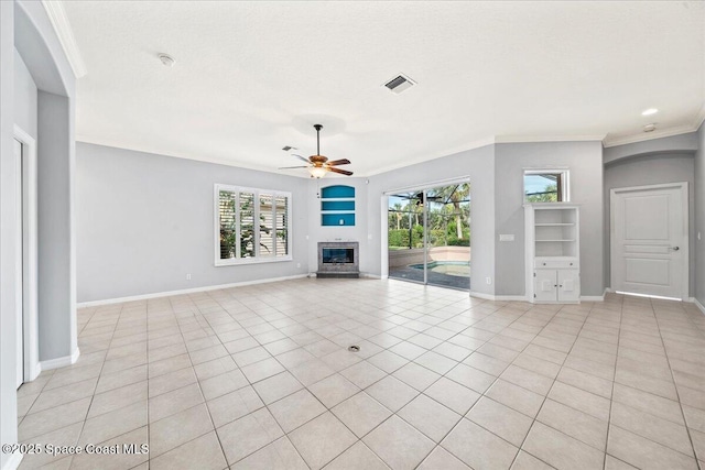 unfurnished living room featuring crown molding, light tile patterned floors, and ceiling fan