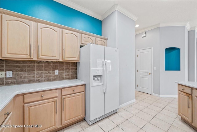 kitchen with light brown cabinetry, tasteful backsplash, ornamental molding, white fridge with ice dispenser, and light tile patterned floors