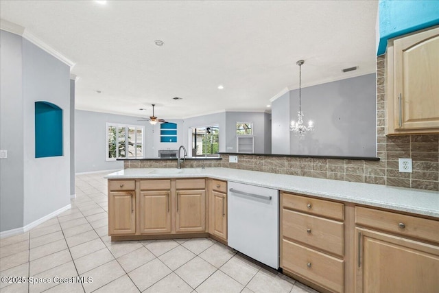 kitchen featuring sink, dishwasher, tasteful backsplash, decorative light fixtures, and light brown cabinets