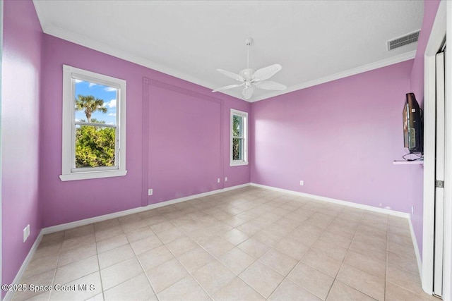 unfurnished room with ceiling fan, ornamental molding, and light tile patterned floors