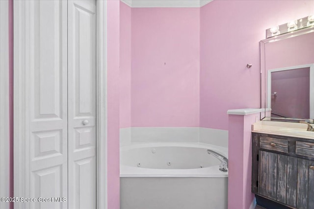 bathroom with vanity and a washtub