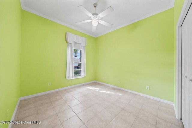 tiled empty room featuring crown molding and ceiling fan