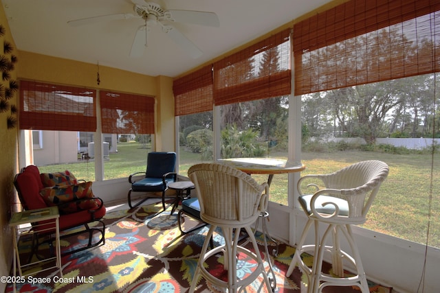 sunroom / solarium with ceiling fan