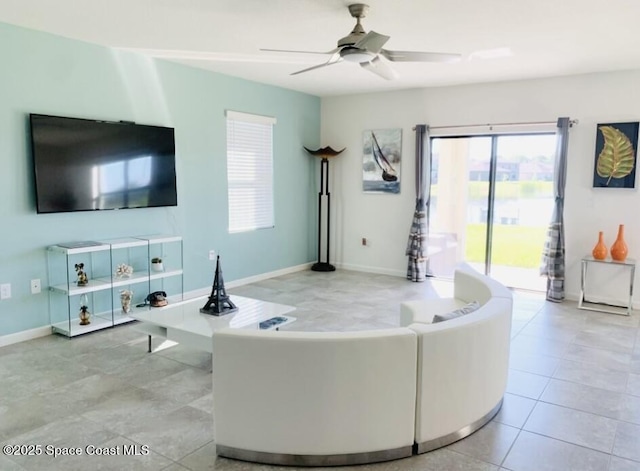 tiled living room with ceiling fan