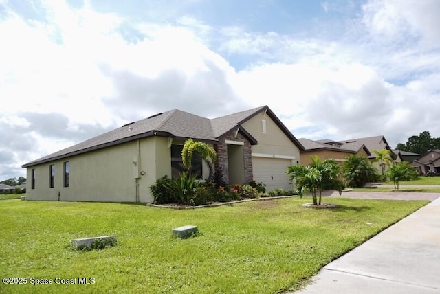 ranch-style house featuring a garage and a front yard