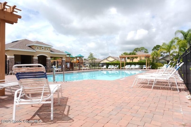 view of pool with a patio and a pergola