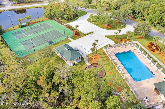 birds eye view of property with a water view