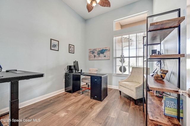 office space with wood-type flooring and ceiling fan