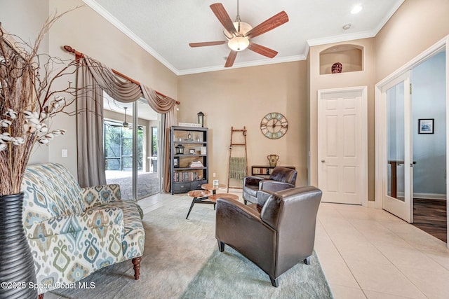 tiled living room with crown molding and ceiling fan