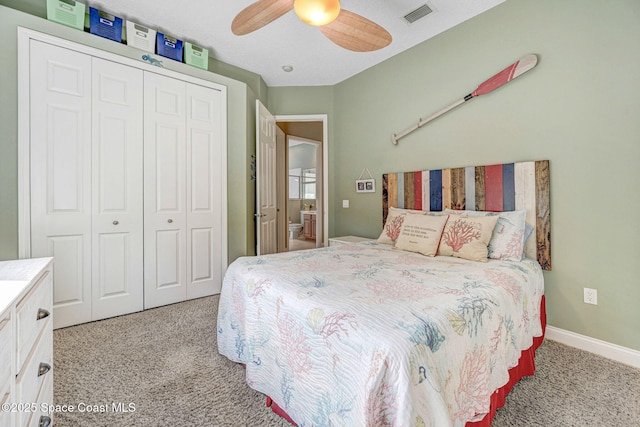 carpeted bedroom featuring ceiling fan and a closet