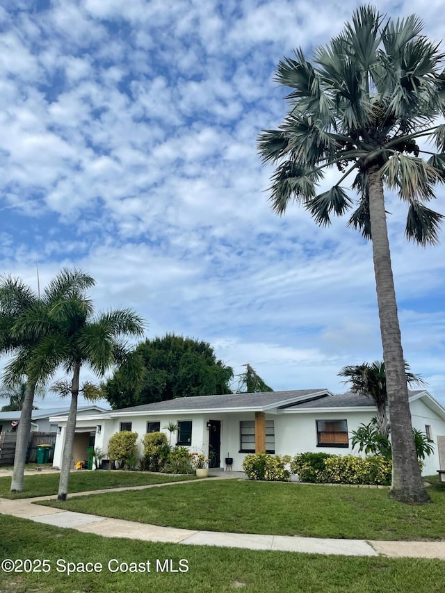 view of front of home with a front yard