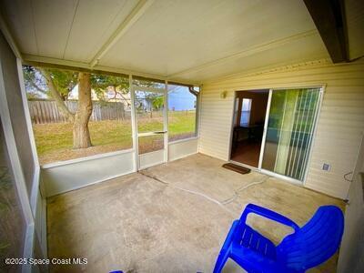 unfurnished sunroom featuring lofted ceiling