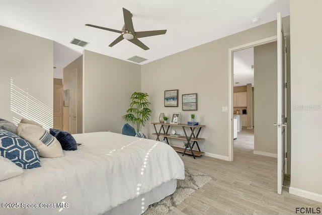 bedroom with light wood-type flooring, visible vents, ceiling fan, and baseboards