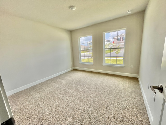 spare room featuring carpet flooring