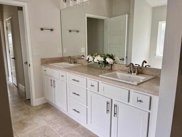 bathroom featuring tile patterned flooring and vanity