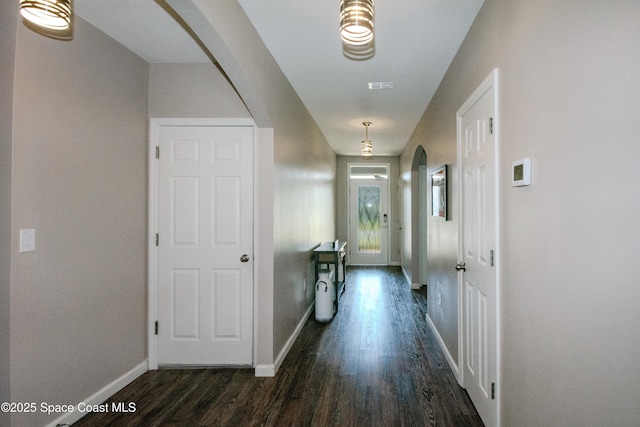 corridor featuring dark hardwood / wood-style flooring