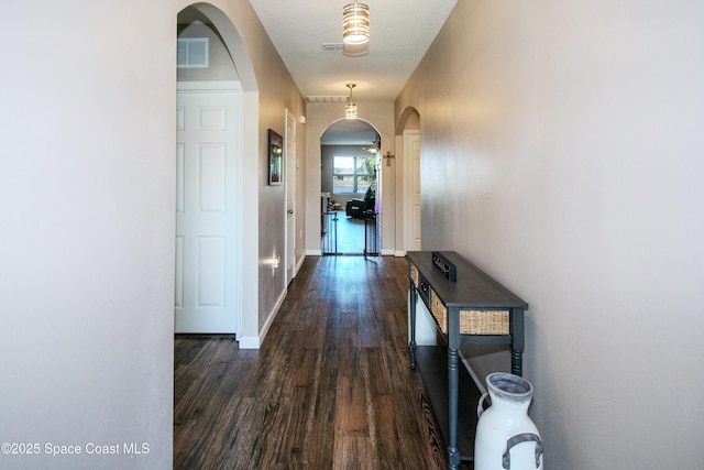 corridor featuring dark hardwood / wood-style floors