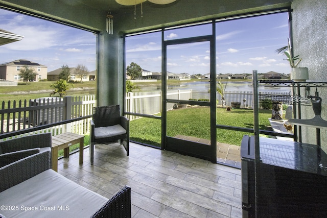 sunroom with a water view