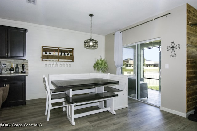 dining area with dark wood-type flooring