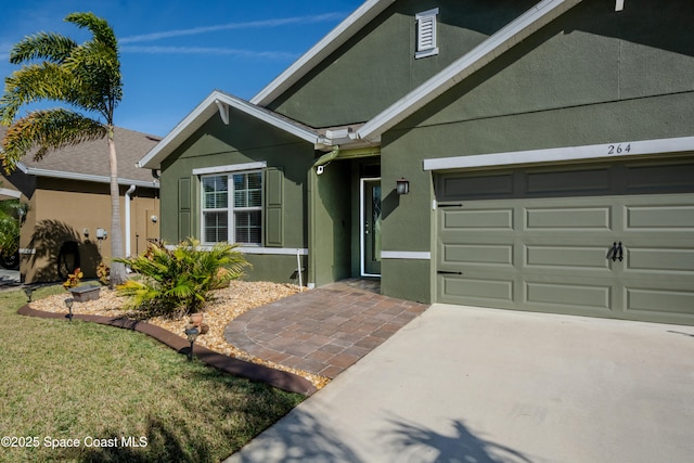 view of front of property with a garage