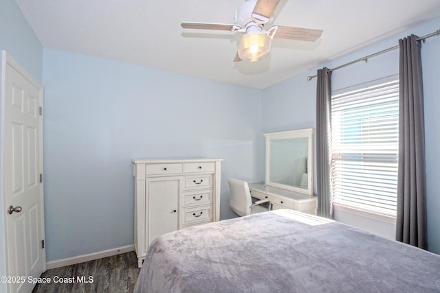 bedroom featuring ceiling fan and dark hardwood / wood-style floors