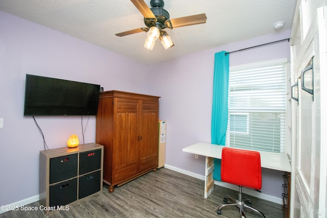 office with wood-type flooring, ceiling fan, and a textured ceiling