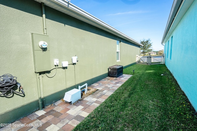 view of property exterior with a yard