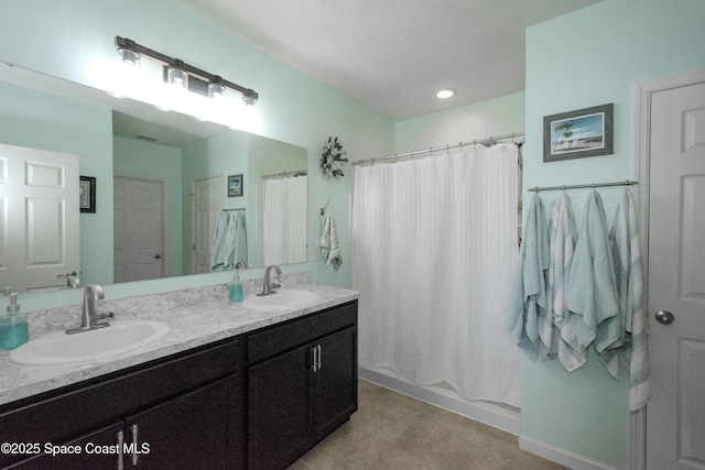 bathroom with shower / tub combo with curtain and vanity