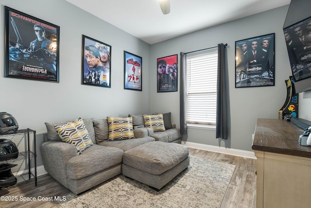 living room featuring hardwood / wood-style flooring and ceiling fan