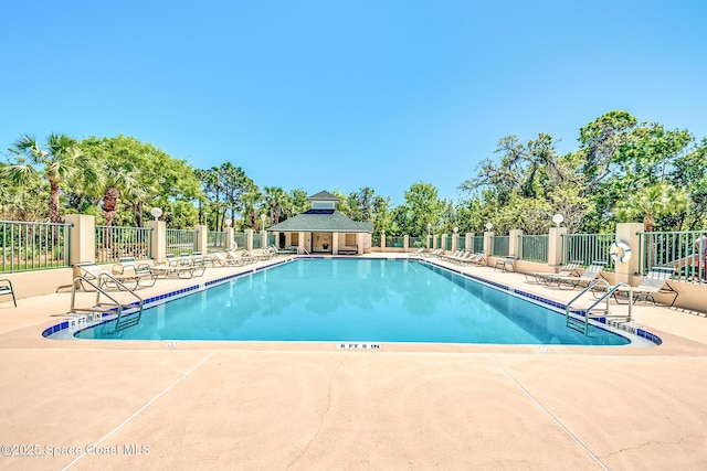 view of swimming pool featuring a patio area