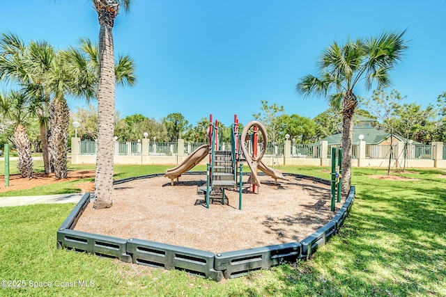 view of playground with a lawn