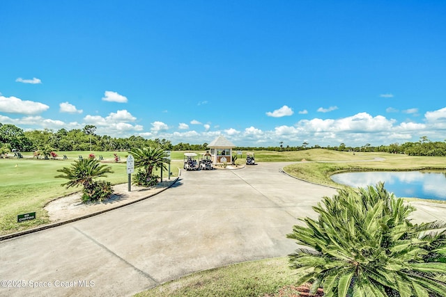 view of home's community featuring a yard, a gazebo, and a water view