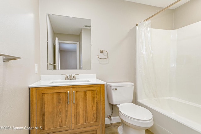 full bathroom featuring shower / tub combo with curtain, vanity, and toilet