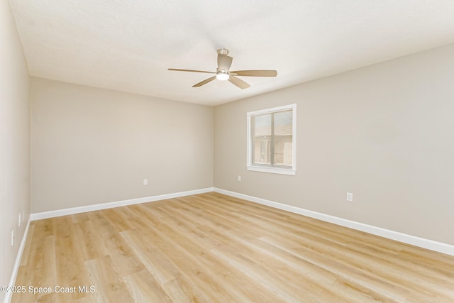 unfurnished room featuring light hardwood / wood-style flooring and ceiling fan