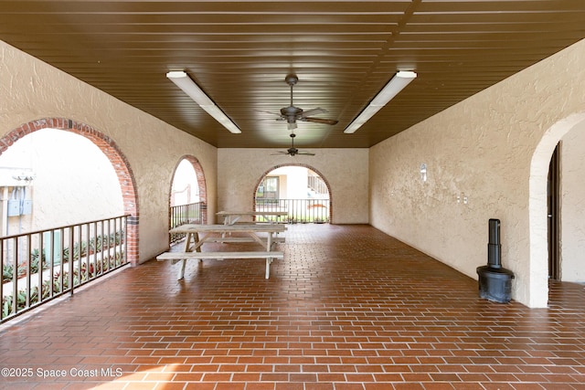 view of patio featuring ceiling fan