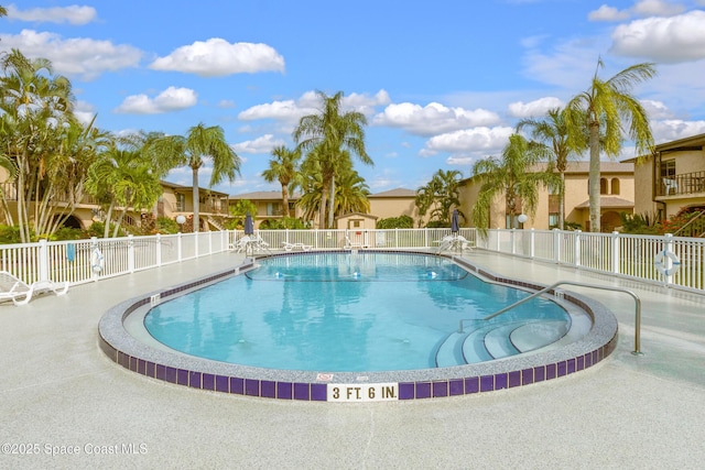 view of swimming pool with a patio area